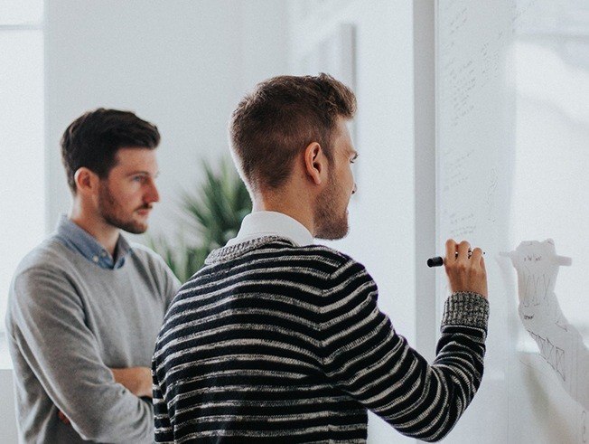Business leaders reviewing a transaction